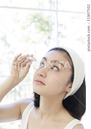 A woman representing an eye drop A woman representing an eye drop 31907502