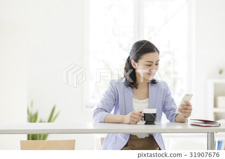 Business woman watching smartphone Business woman watching smartphone 31907676