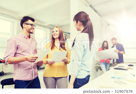 creative team on coffee break talking at office creative team on coffee break talking at office 31907876