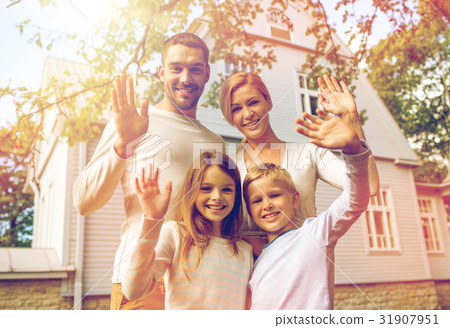 happy family in front of house outdoors 31907951