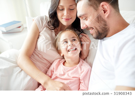 happy family in bed at home happy family in bed at home 31908343