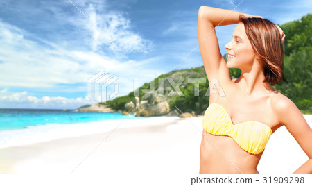 happy woman in bikini swimsuit on tropical beach happy woman in bikini swimsuit on tropical beach 31909298