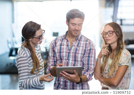 Business colleagues using digital tablet 31909732