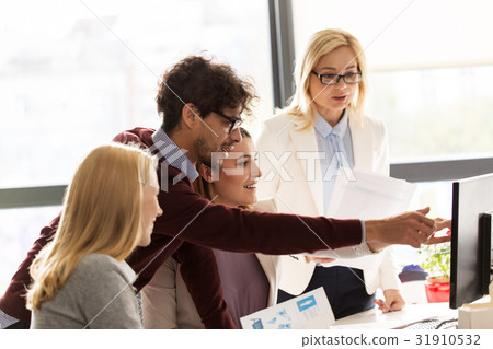 happy creative team with computer in office 31910532