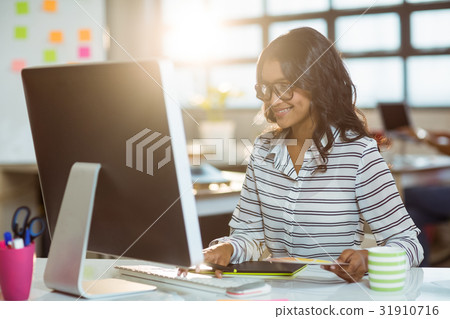 Graphic designer working on computer 31910716