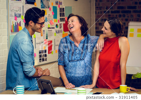 Business people interacting in office 31911405