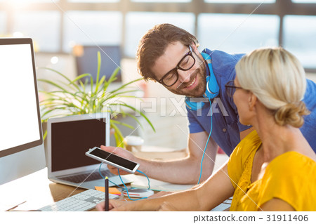 Graphic designers interacting with each other 31911406