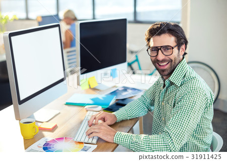 Graphic designer working on computer 31911425