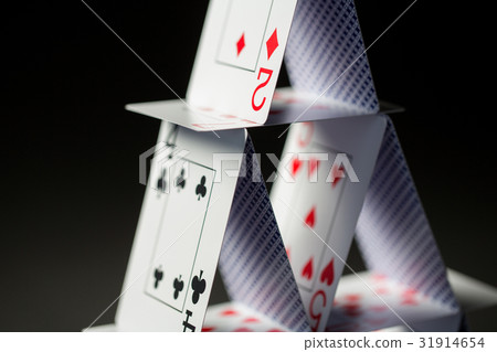 close up of house of playing cards over black close up of house of playing cards over black 31914654