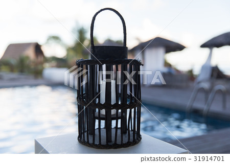 lantern with candle at outdoor swimming pool 31914701