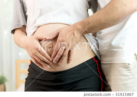 Pregnant Woman and Her Husband in Family Concept Pregnant Woman and Her Husband in Family Concept 31915867