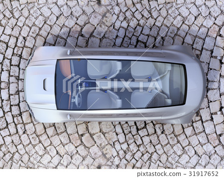 A bird's eye view of an electric car stopped at a cobblestone road A bird's eye view of an electric car stopped at a cobblestone road 31917652