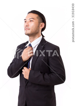 businessman fastening his necktie, ready to work 31918430