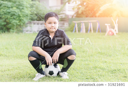 obese fat boy soccer player sit on football obese fat boy soccer player sit on football 31921691