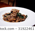 The picture of stir fried beef stew with basil. 31922461