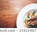 The picture of fusilli and bolognese sauce. 31922467