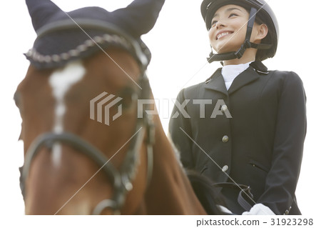 Women riding a horse Women riding a horse 31923298