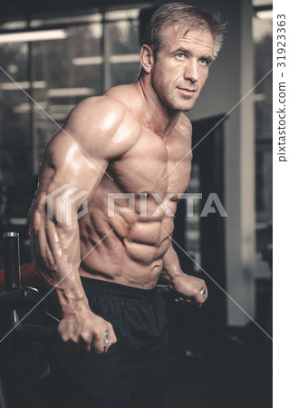 Brutal caucasian handsome fitness men on diet training chest pum 31923363
