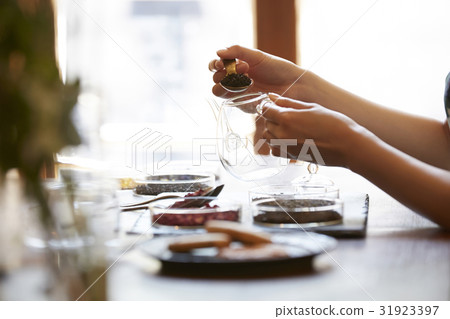 A woman enjoying tea 31923397