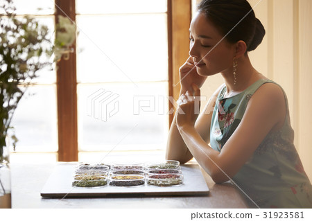 A woman enjoying tea A woman enjoying tea 31923581