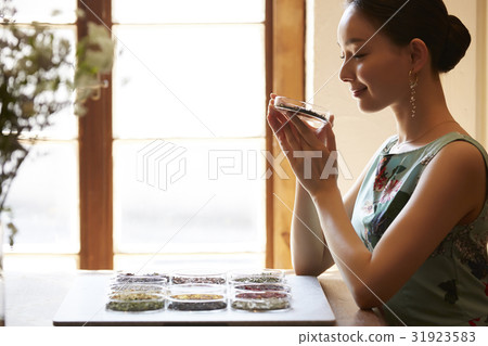 A woman enjoying tea A woman enjoying tea 31923583