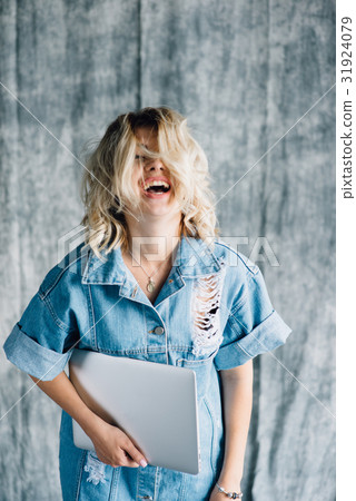 图库照片: cute pretty girl with laptop smiling