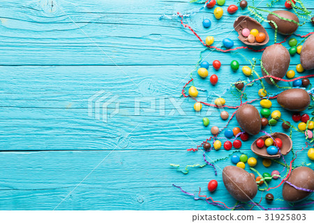 Chocolate eggs, colorful candy ,ribbons 31925803