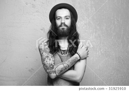 hipster boy with tattoo and long hair hipster boy with tattoo and long hair 31925910