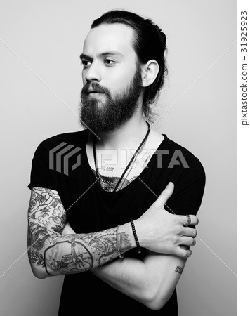 handsome bearded man with tattoo 31925923