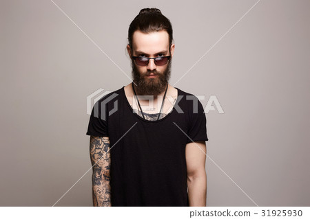 man with tattoo and sunglasses 31925930