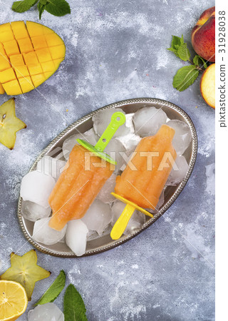 Homemade yellow popsicles 31928038