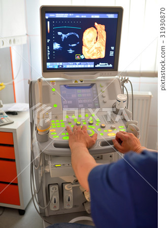 Doctor Examining Pregnant Belly 31930870