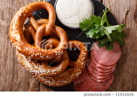 German salted pretzels, salami and sauce German salted pretzels, salami and sauce 31932026
