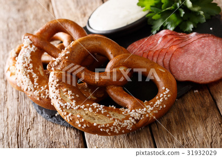 German salted pretzels, salami and sauce 31932029