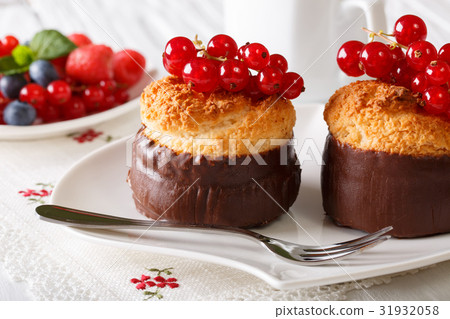 Tasty chocolate coconut muffins with red currant 31932058