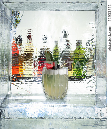 Tasty cocktail in the ice cube. Close up 31933831