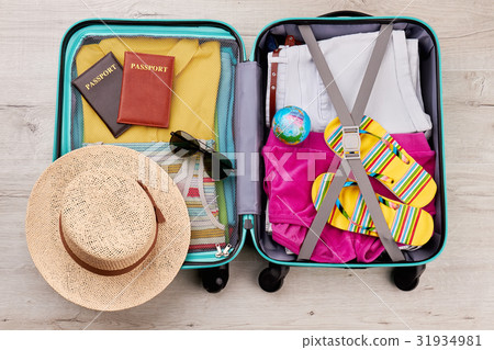 Tourist travel bag full of clothing. Tourist travel bag full of clothing. 31934981