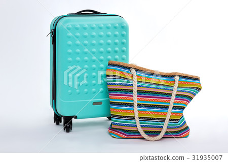 Modern blue suitcase, beach handbag. 31935007