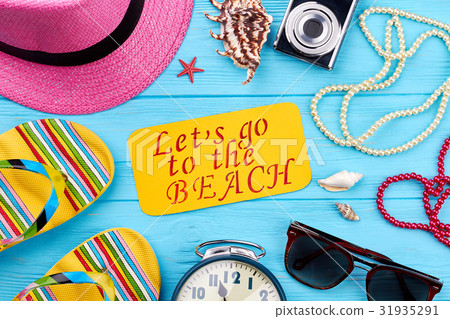 Beach accessories on blue background. Beach accessories on blue background. 31935291