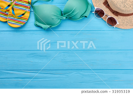 Woman beach accessories on sea background. Woman beach accessories on sea background. 31935319