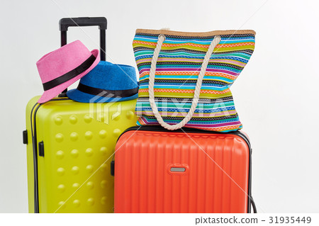 Bright accessories on summer suitcases. 31935449