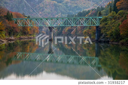 Bridge at Tadami river in autumn season. Bridge at Tadami river in autumn season. 31938217