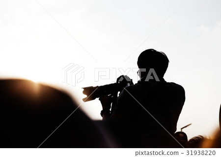 Photographers are shooting at sunset. 31938220