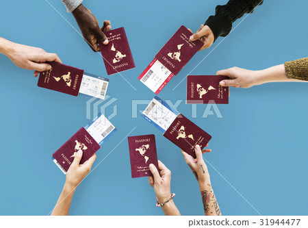 Group of hands holding passport in aerial view 31944477