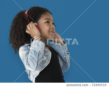 Little Girl Listening To Music Headphones 31944510