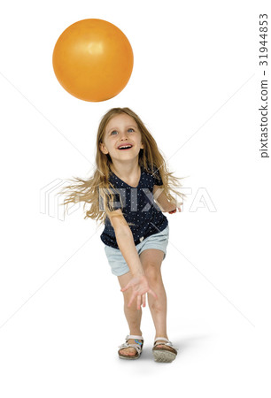 Young caucasian girl with an orange ball Young caucasian girl with an orange ball 31944853