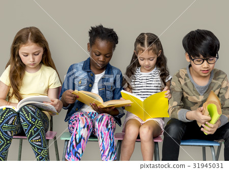 Group of children reading a book 31945031