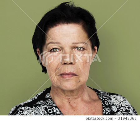 Senior adult woman in moody studio portrait 31945365