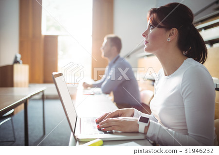 Mature student using laptop Mature student using laptop 31946232