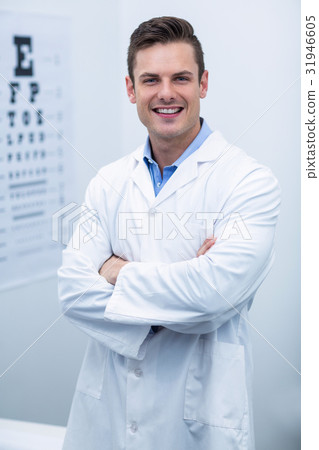 Optometrist standing in ophthalmology clinic Optometrist standing in ophthalmology clinic 31946605